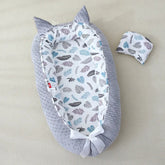 Couffin bébé Douce Étoile du Nid en décoration dans une chambre